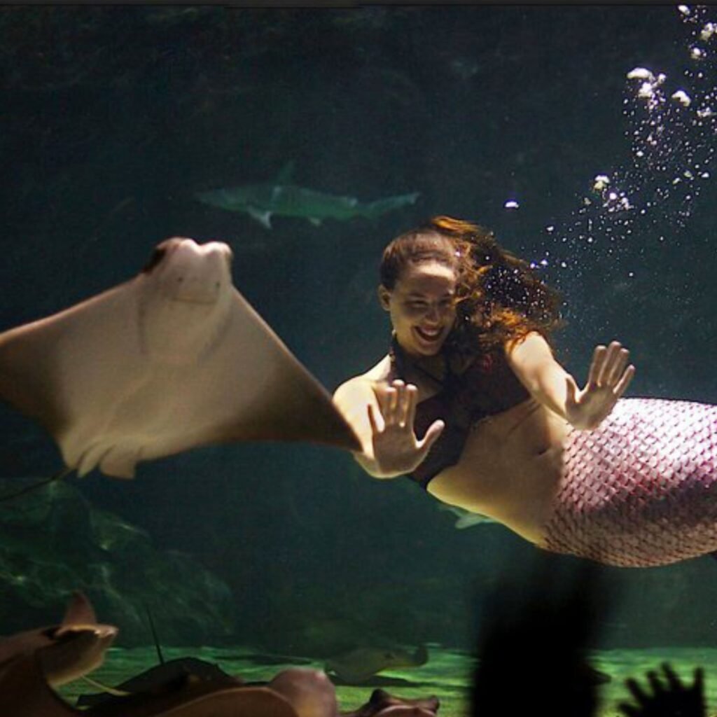 Your host Shannon Scott, one of Ripley’s Aquarium’s first free-diving mermaids, smiling about the upcoming Halloween Mermaid Retreat!