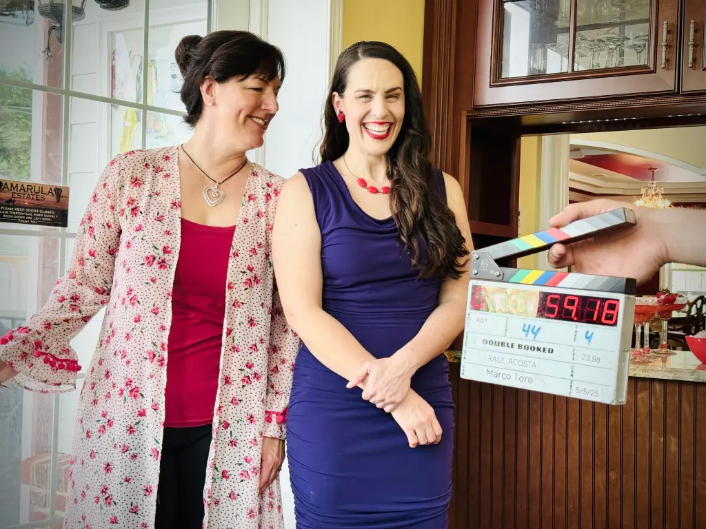 Meet The Dream Team duo Shannon Scott and Toni Deckers laughing together on set during The Bright Stars Greenroom Retreat while filming the short film Double Booked