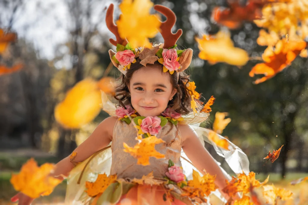 A young fairy throwing leaves, representing the power of inner child healing. 