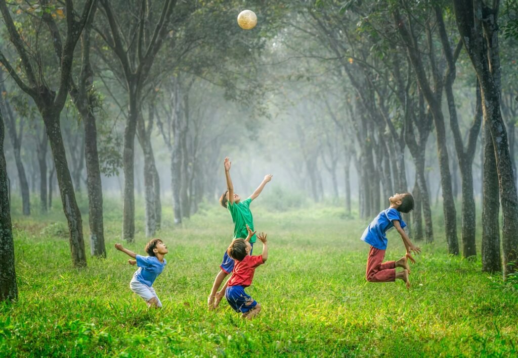 The power of play frees us all. You can see it in these four boys playing ball in nature.