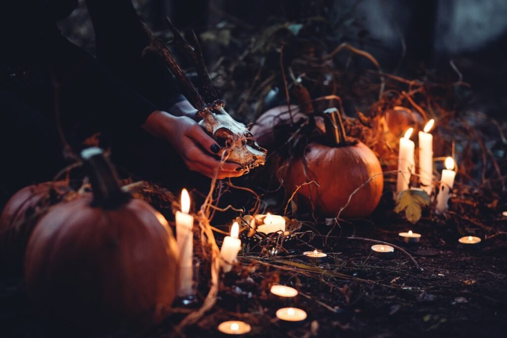 Cozy Halloween scene with glowing pumpkins and candles, symbolizing creative empowerment retreat atmosphere