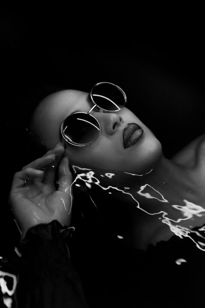 Fashion model wearing glasses, representing the importance of professional references in modeling.