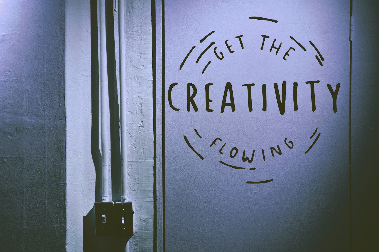 Person writing in a journal during a human creativity retreats, getting creativity flowing in a supportive environment