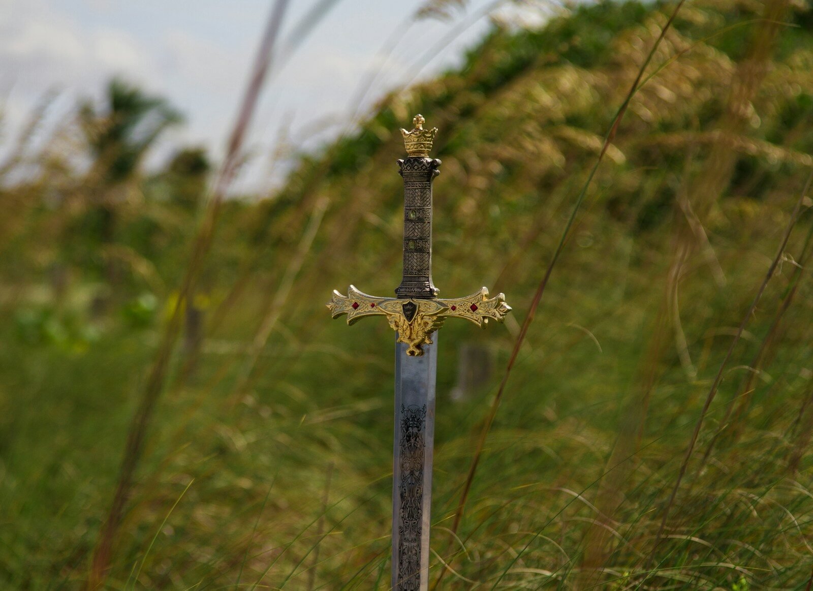 A sword resting on the ground, representing Fantasy Fitness, title sponsor of The Starlight Gathering